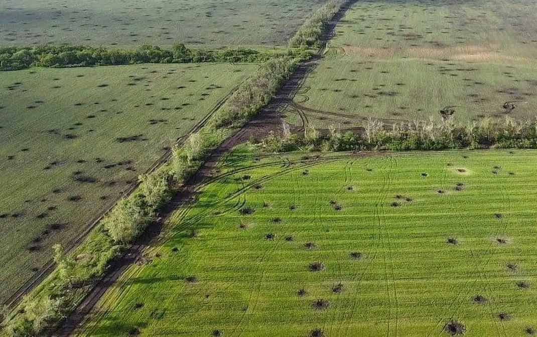 Farm fields with holes from bombs